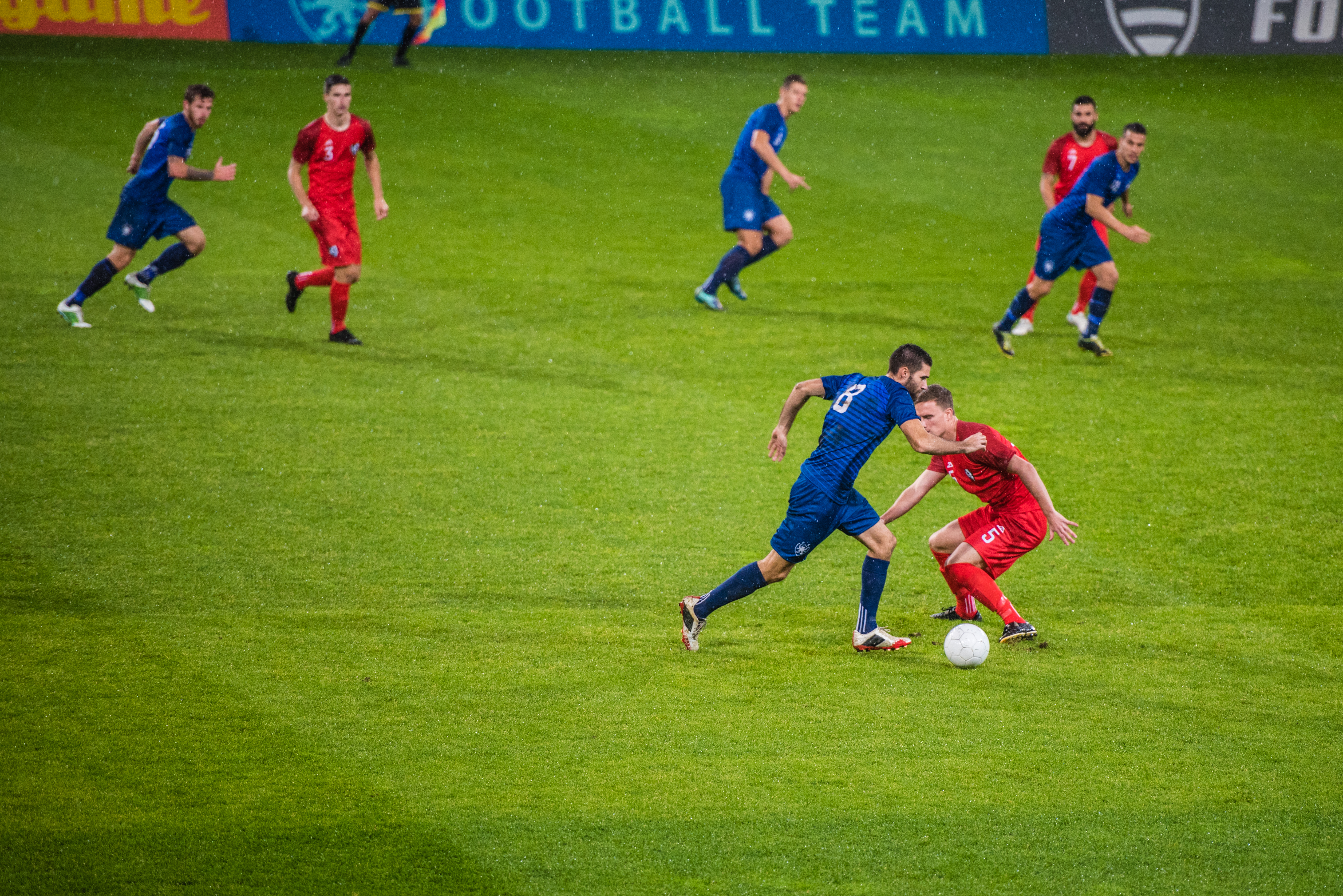 soccer players in action on the field