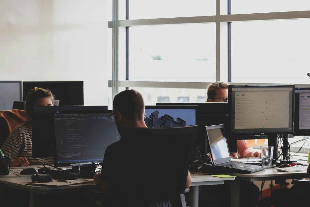 people working on computers in an office