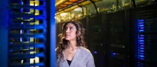 woman standing in server room