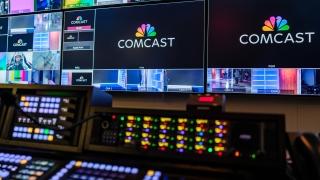 Screens with video editing equipment beneath 