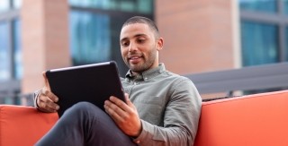 man watching tablet