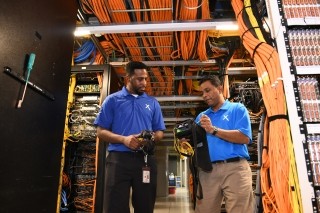 comcast employees working in a tech facility