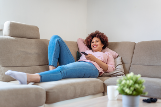 people woman remote couch