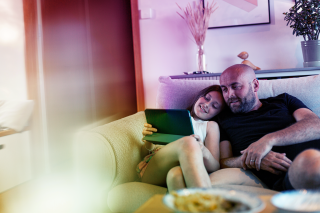 people man kid couch tablet