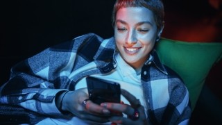 a woman looking at her phone