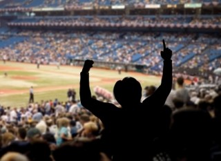sports fan cheering at a baseball game