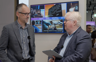 Two people chatting at a conference