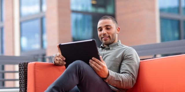 man_watching_tablet.jpg