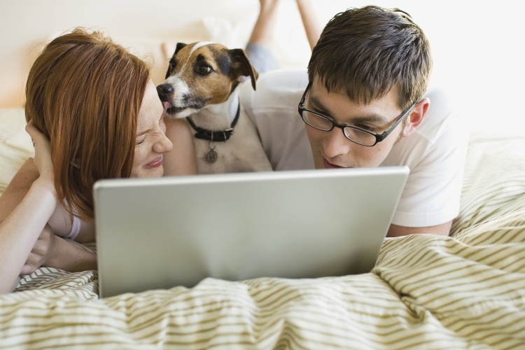 Couple with Dog on Laptop