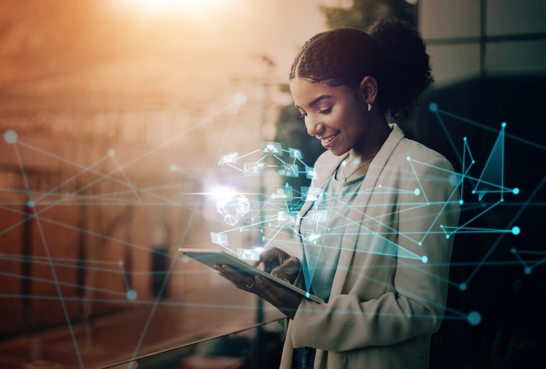 abstract image of a woman holding a tablet with imaginary technology lines around her