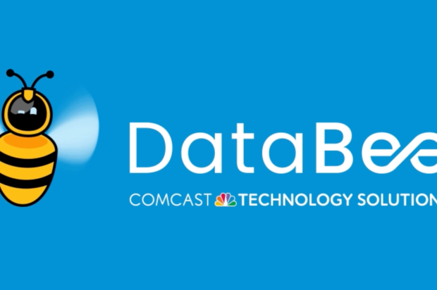 Animated bee buzzing around next to DataBee logo lockup with Comcast Technology Solutions