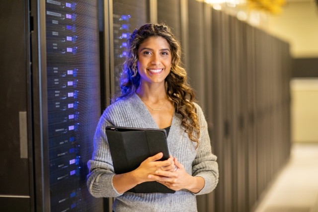 Portrait of a woman in a server room