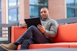 man watching tablet