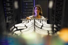 woman working on server rack