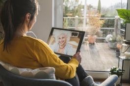 Woman video chatting on a tablet