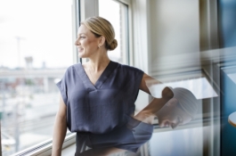 woman looking out office window