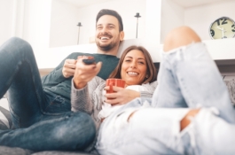 couple on couch watching tv