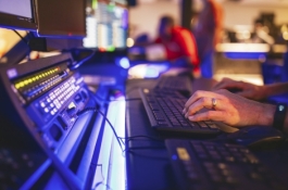 Hands typing on keyboard of laptop