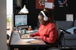 woman in headphones at desk