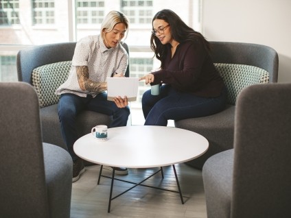 Business People looking at Tablet