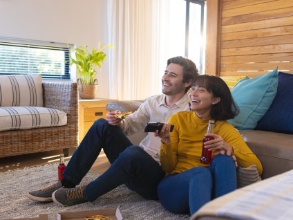 people couple watching TV