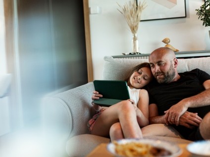 people man kid couch tablet