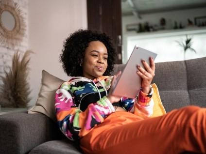 people woman couch tablet