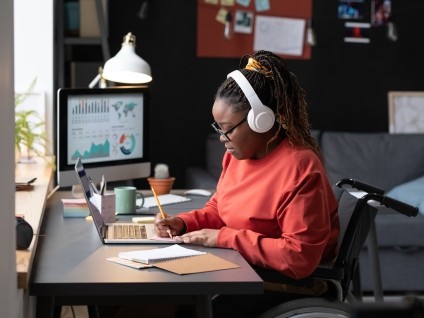 woman in headphones at desk