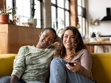 people women couch tv remote