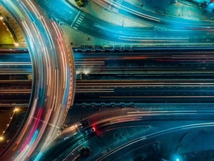 abstractc city highway with moving lit up traffic at night 