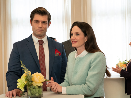 a man and woman dressed nicely and smiling
