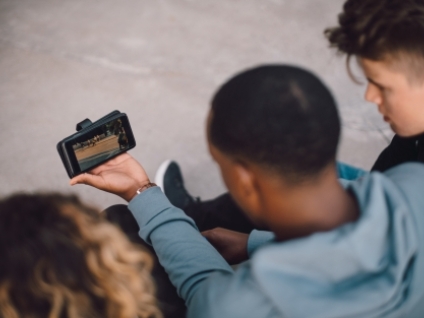 people watching sports on a phone