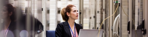 Woman working in server room
